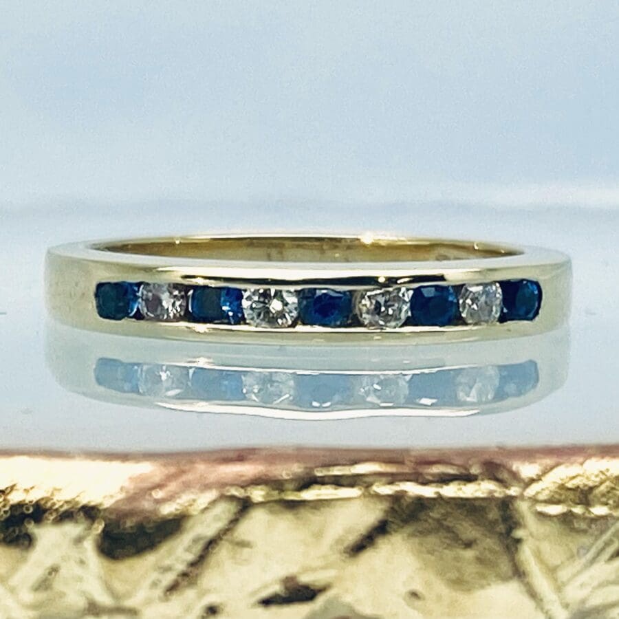 132000569ct Yellow Gold Diamond And Blue Sapphire Eternity Ring