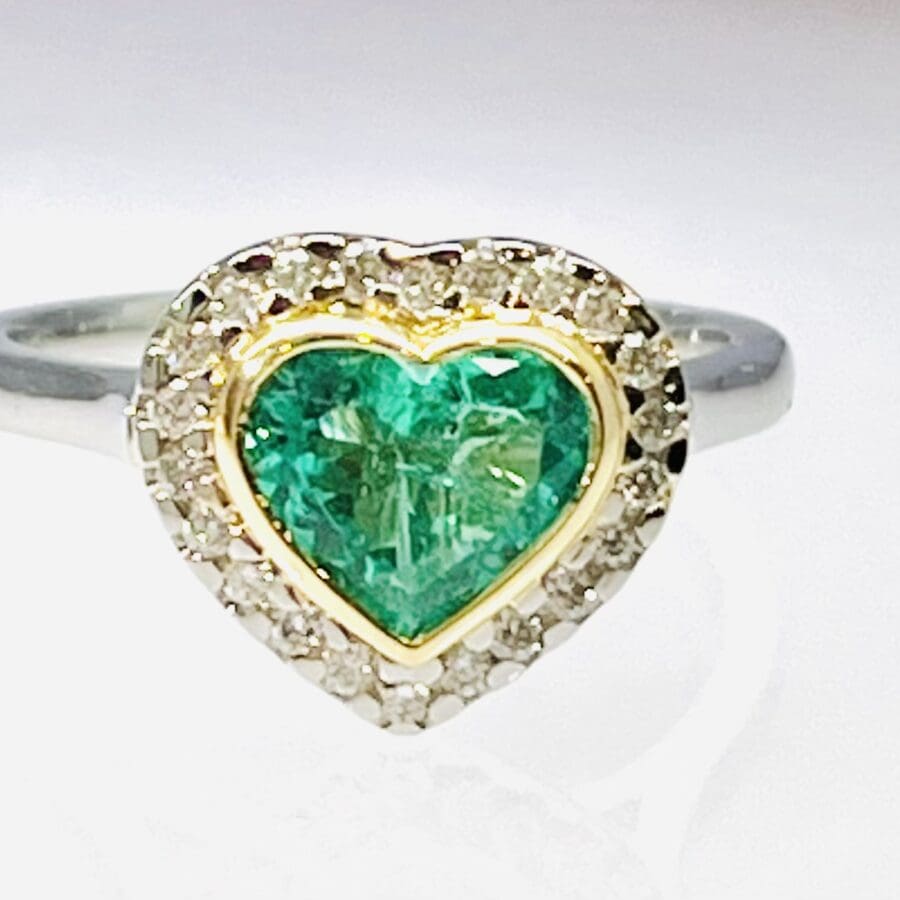 15600058 Platinum And 18ct Yellow Gold Emerald And Diamond Rub Over Heart Ring