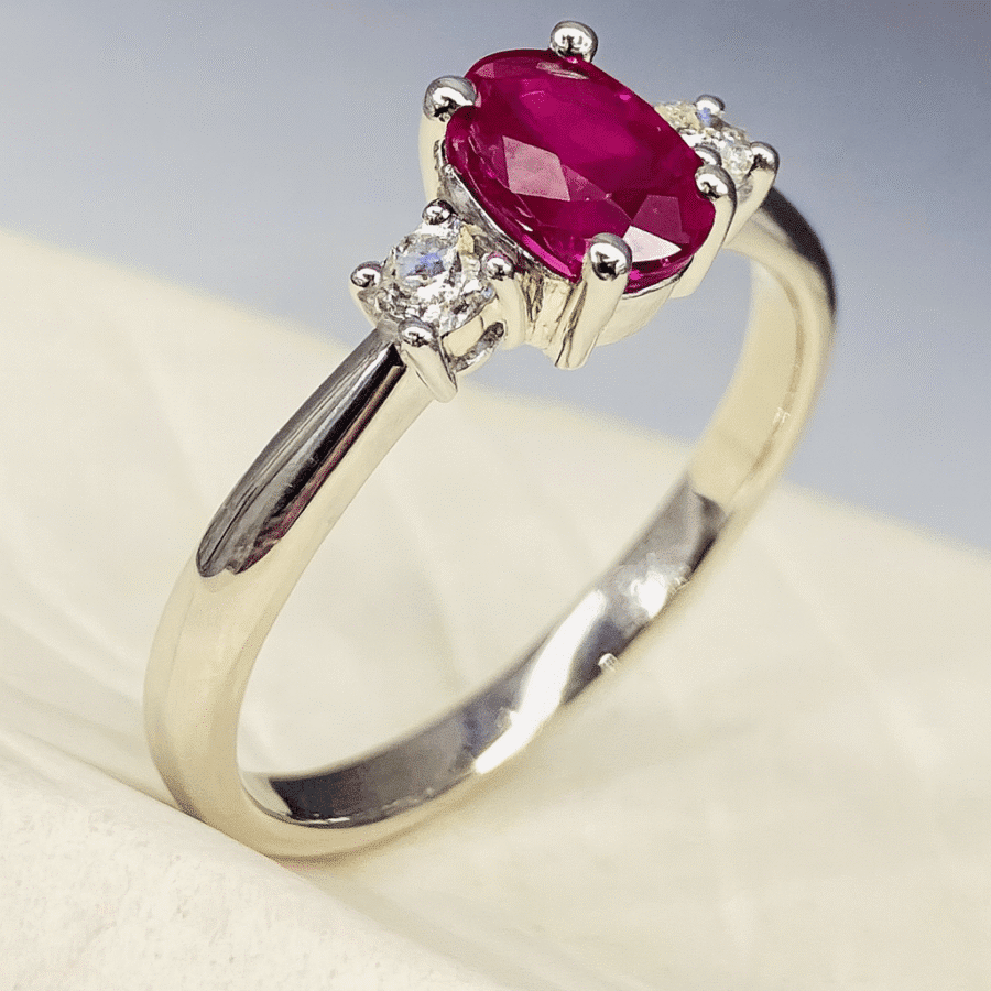 15600059 Platinum Oval Ruby 0.50ct And Diamond Trilogy Ring