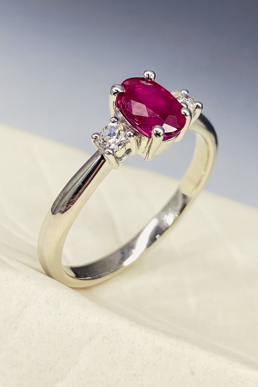 15600059 Platinum Oval Ruby 0.50ct And Diamond Trilogy Ring